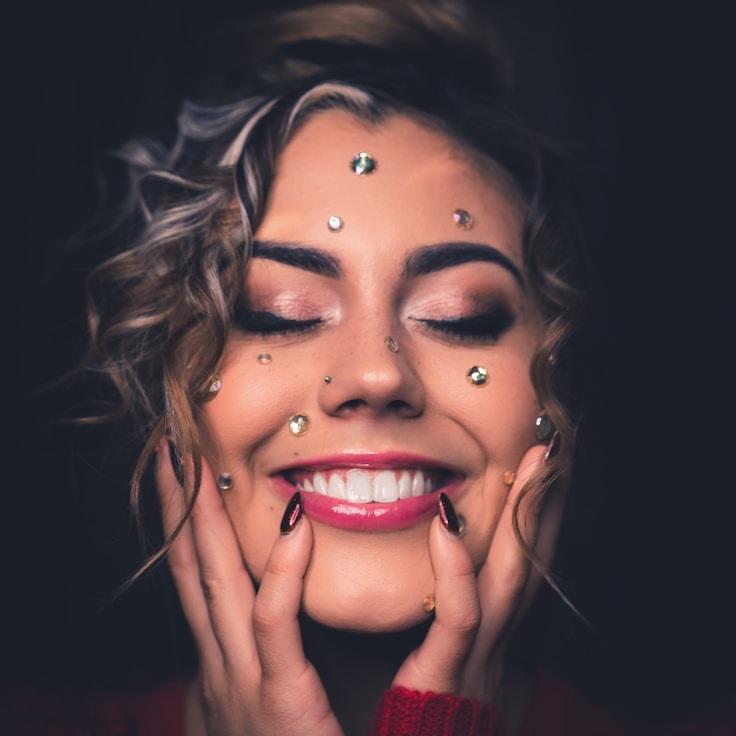 Ariel Kapoor, Lead Design Curator at Distributed Logic Framework, reviewing corporate floral arrangements